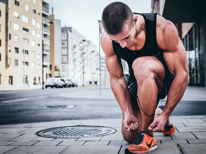 personal trainer running in community