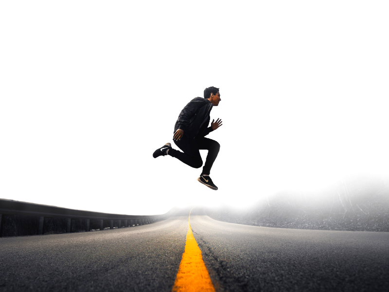 man jumps in middle of the road