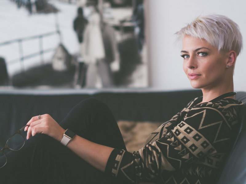 woman sitting in a chair waiting for salon online booking